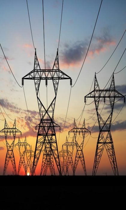 3D Electric powerlines over sunrise